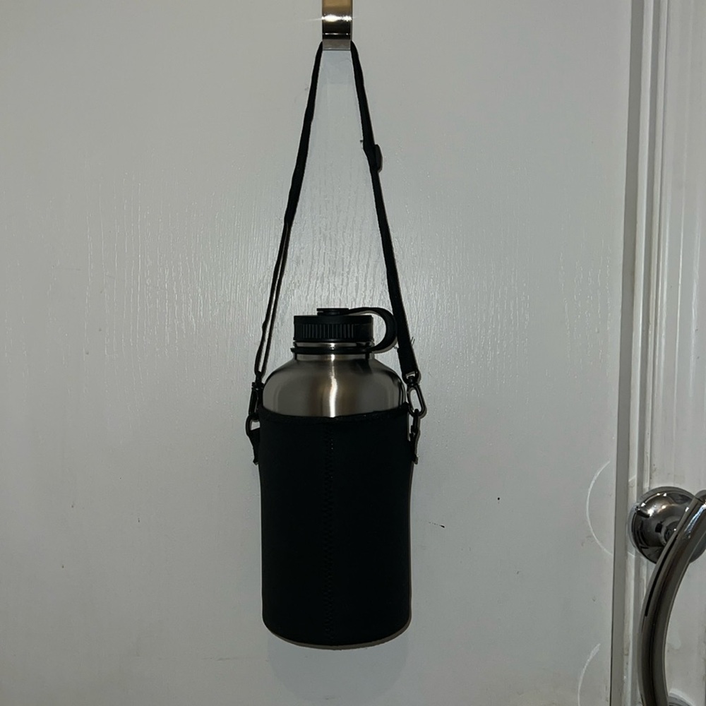 Aluminum water bottle with neoprene sleeve and strap